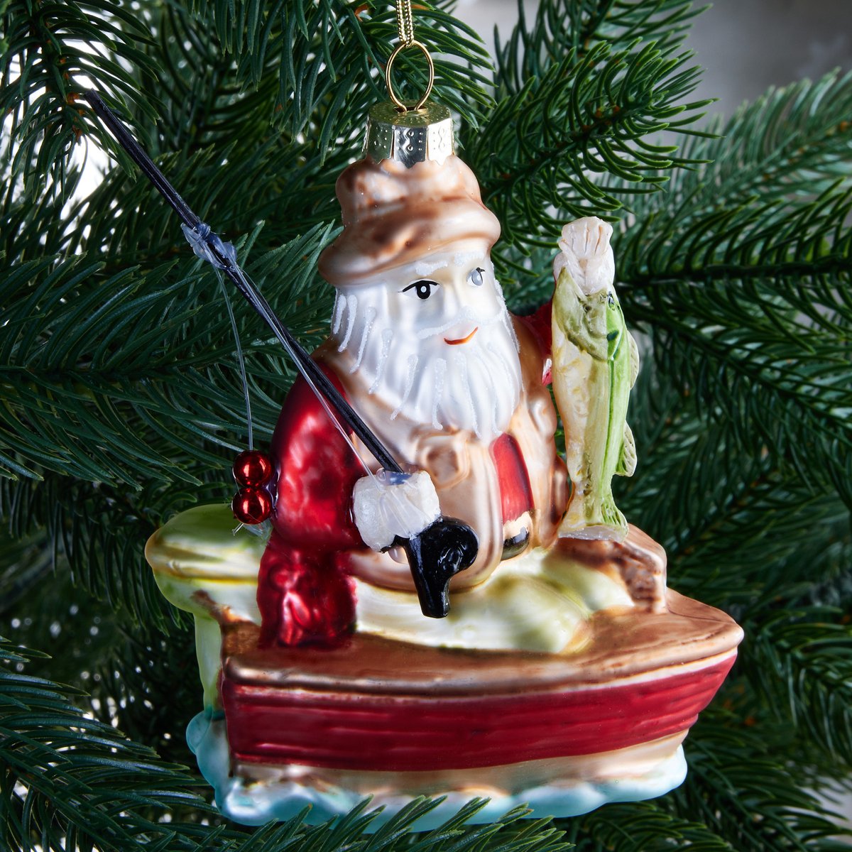 Boule de Noël en verre Père Noël avec canne à pêche